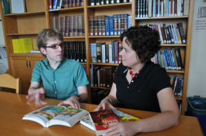 Mount Allison religious studies student Lucas Cober, left with religious studies professor Dr. Fiona Black is studying contemporary illustrated Bibles and issues representing the scared